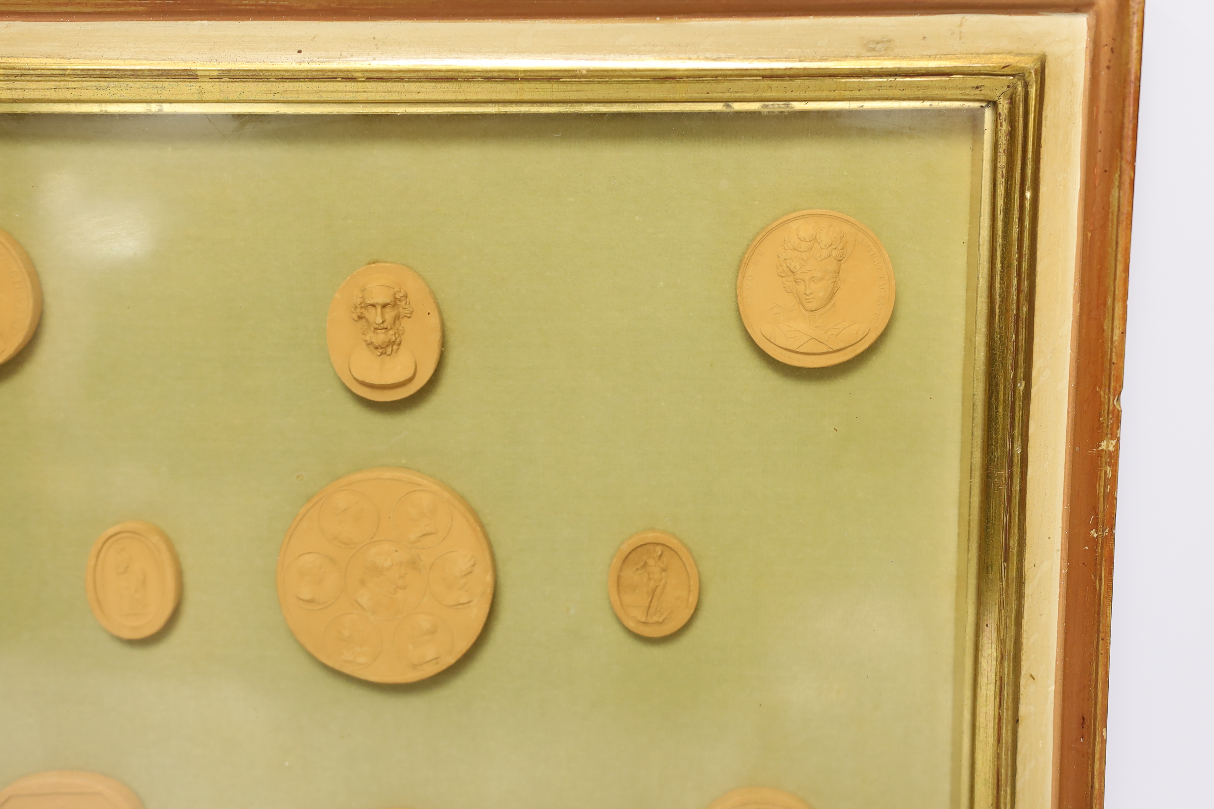 A framed set of nine grand tour medallions, 30x37cm total